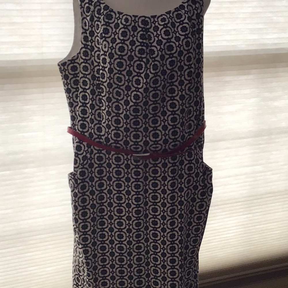 Sheath dress. Black and white with red patent belt.